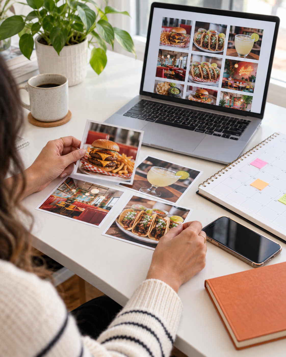 Hands arranging business photography and a social content plan